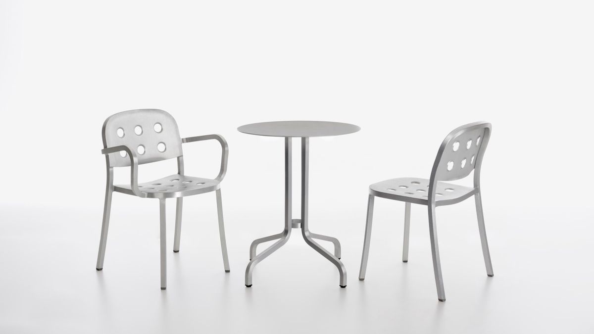 Slim aluminium outdoor chairs around a table, illustrating scale, drainage and exposure checks for Australian spaces
