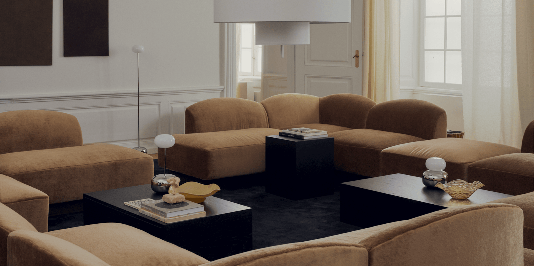 New Works modular seating, Kizu lamps and dark wood tables in a Copenhagen interior