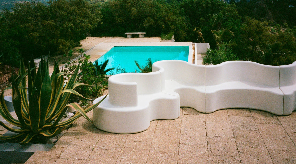 VERPAN Cloverleaf sofa by Verner Panton beside a Mediterranean pool
