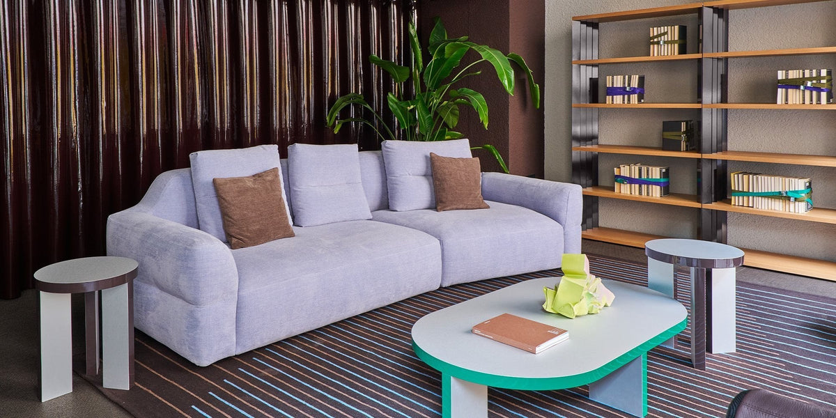 Zanotta contemporary living room with modular sofa, tables and shelving