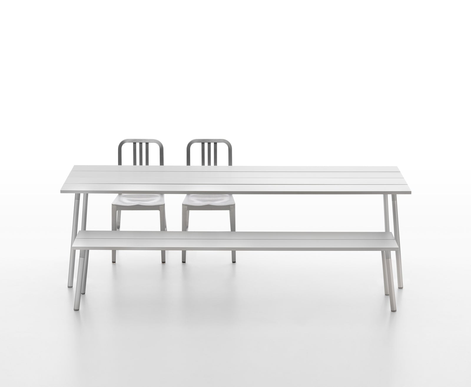 Run aluminium bench and table with two 1006 Navy Chairs — Emeco