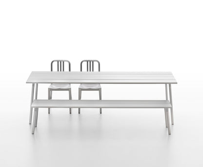 Run aluminium bench and table with two 1006 Navy Chairs — Emeco