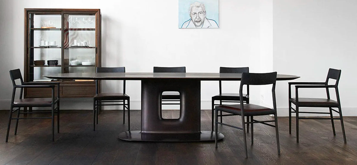 Sculpture Casting Bronze Table with dining chairs in a residential room
