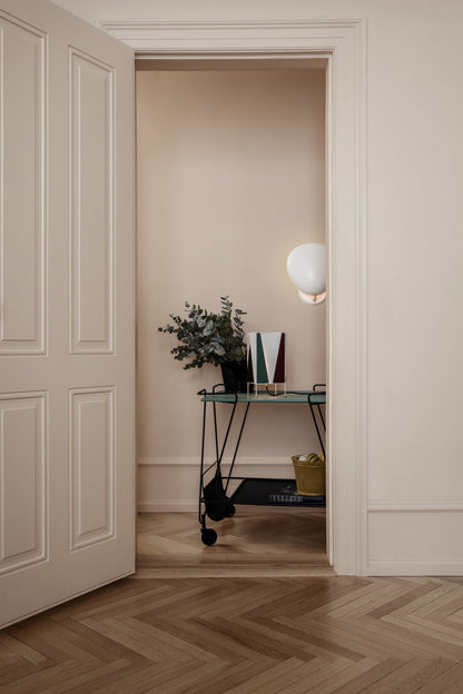 GUBI Matégot Flower Pot by Mathieu Matégot styled with lighting and furniture