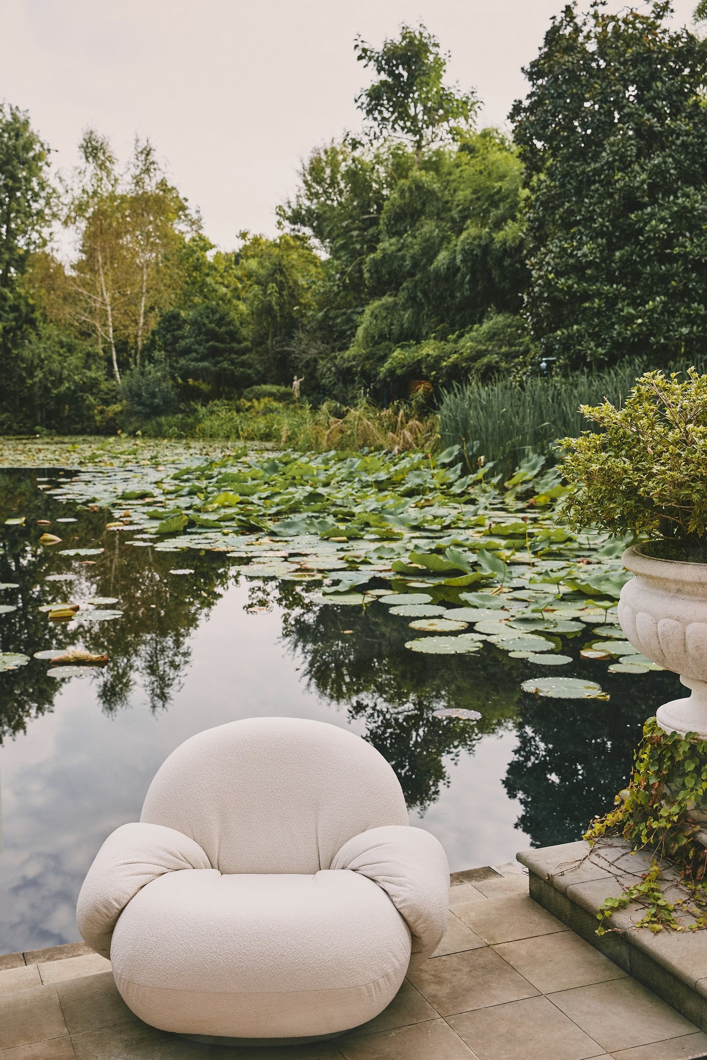 Pacha Outdoor Lounge Chair with armrest by GUBI — Lifestyle Images 3 of 7