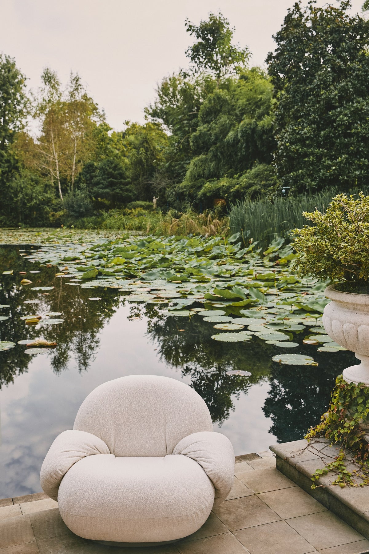 Pacha Outdoor Lounge Chair with armrest by GUBI — Lifestyle Images 3 of 7