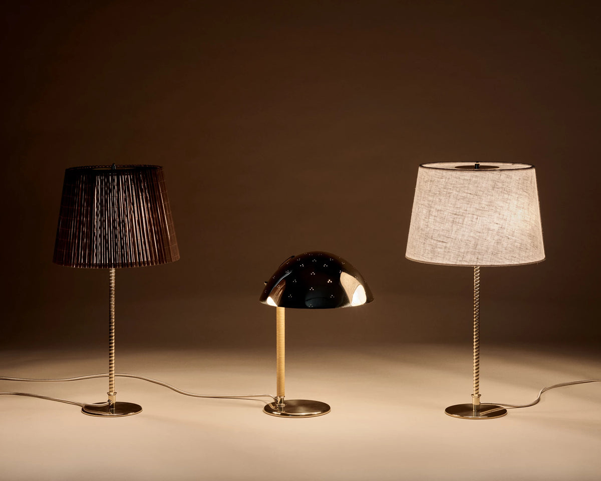 9205 Table Lamp by GUBI shown in an interior setting, view 1