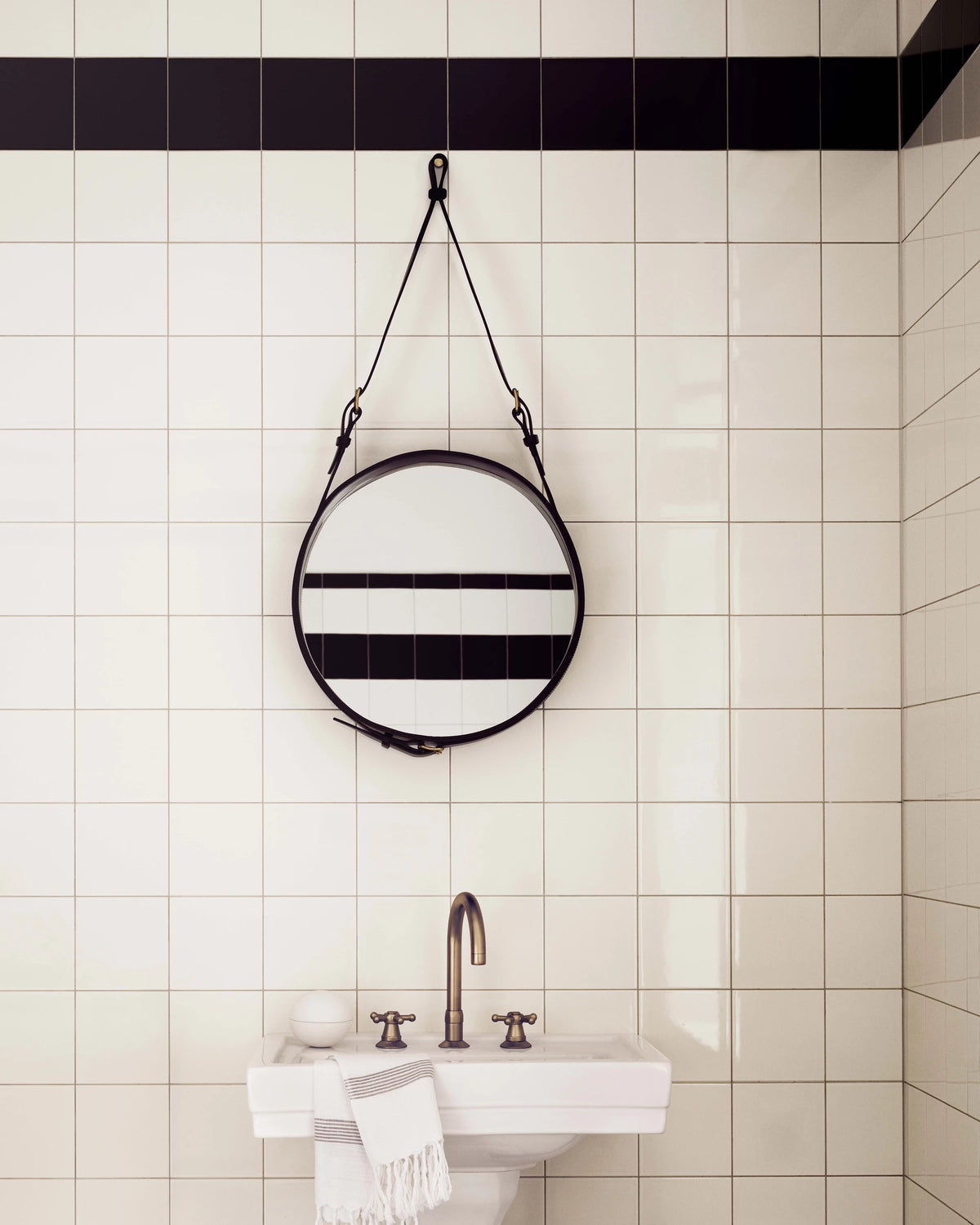 Adnet Wall Mirror, Circular by GUBI shown in an interior setting, view 3
