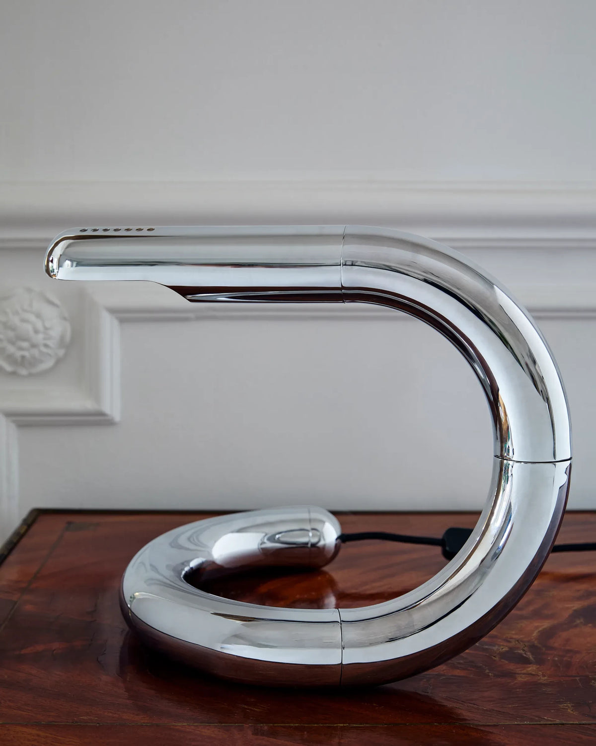 Aspide Table Lamp by GUBI shown in an interior setting, view 1
