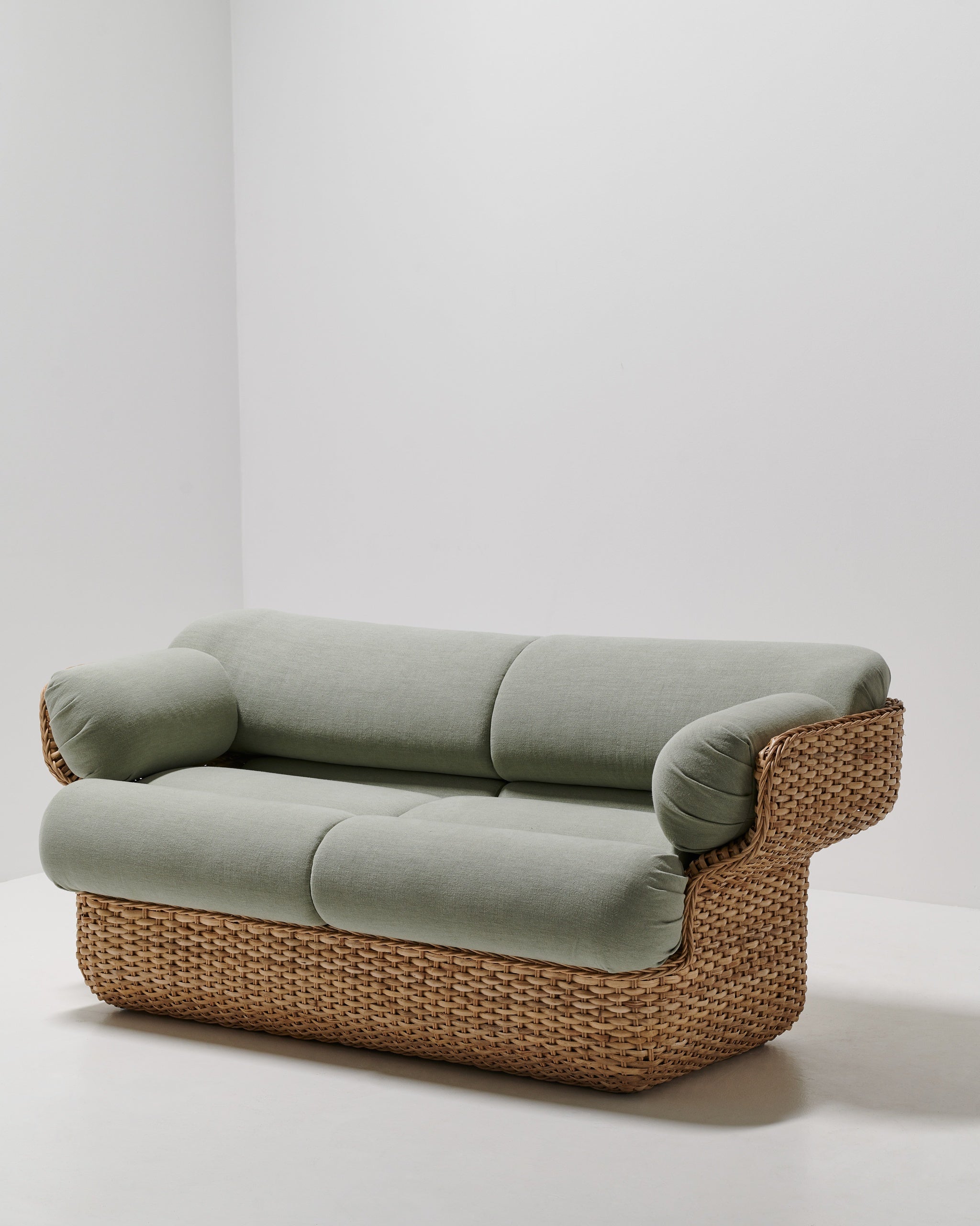 Basket Two-Seater Sofa by GUBI shown in an interior setting