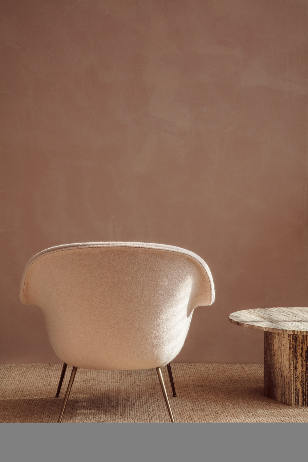 Bat Lounge Chair by GUBI shown in an interior setting