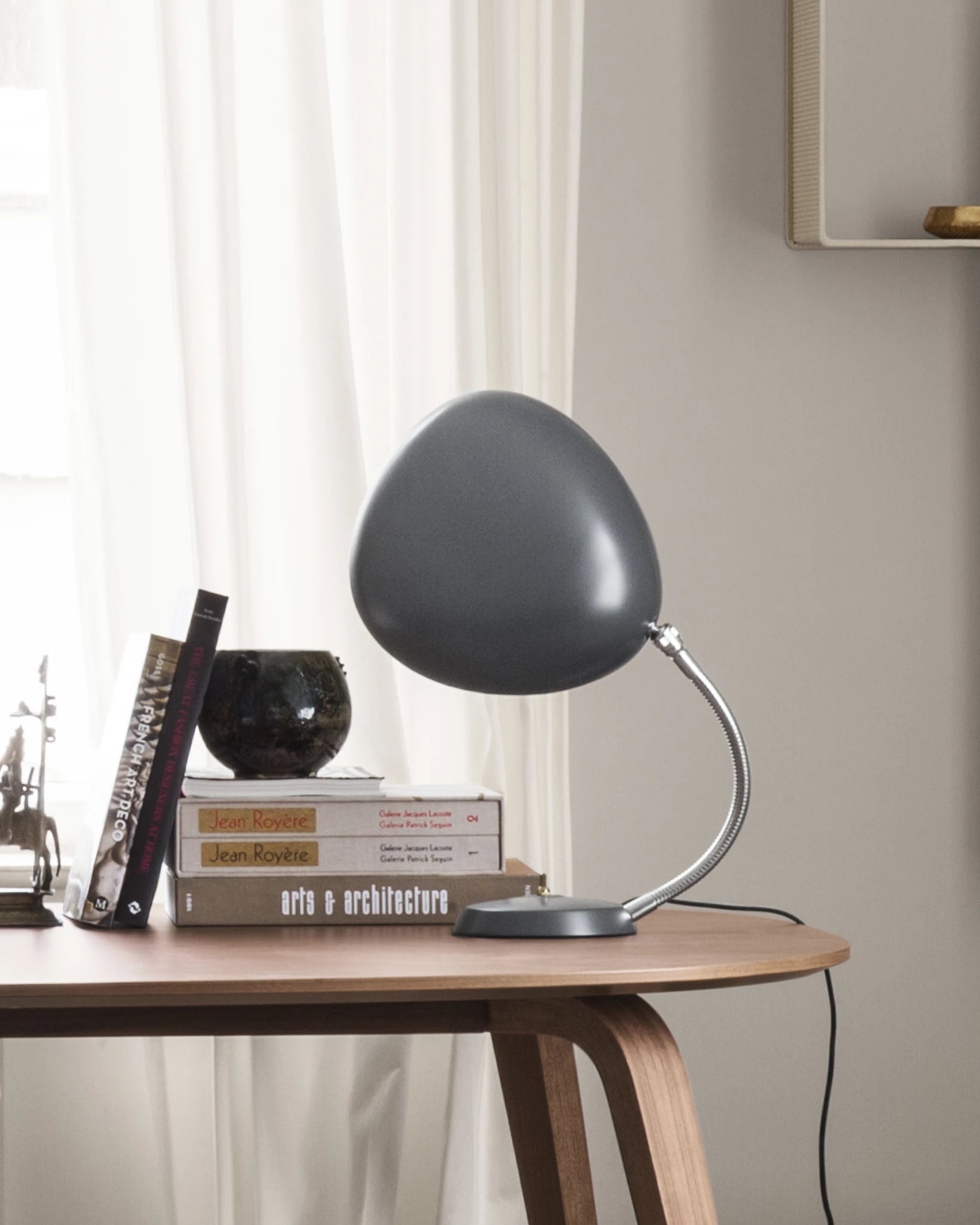 Cobra Table Lamp by GUBI shown in an interior setting