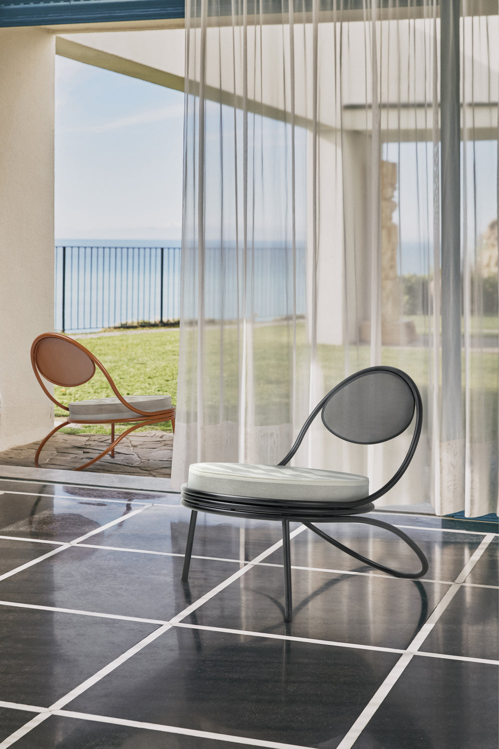 Copacabana Outdoor Lounge Chair by GUBI shown in an interior setting