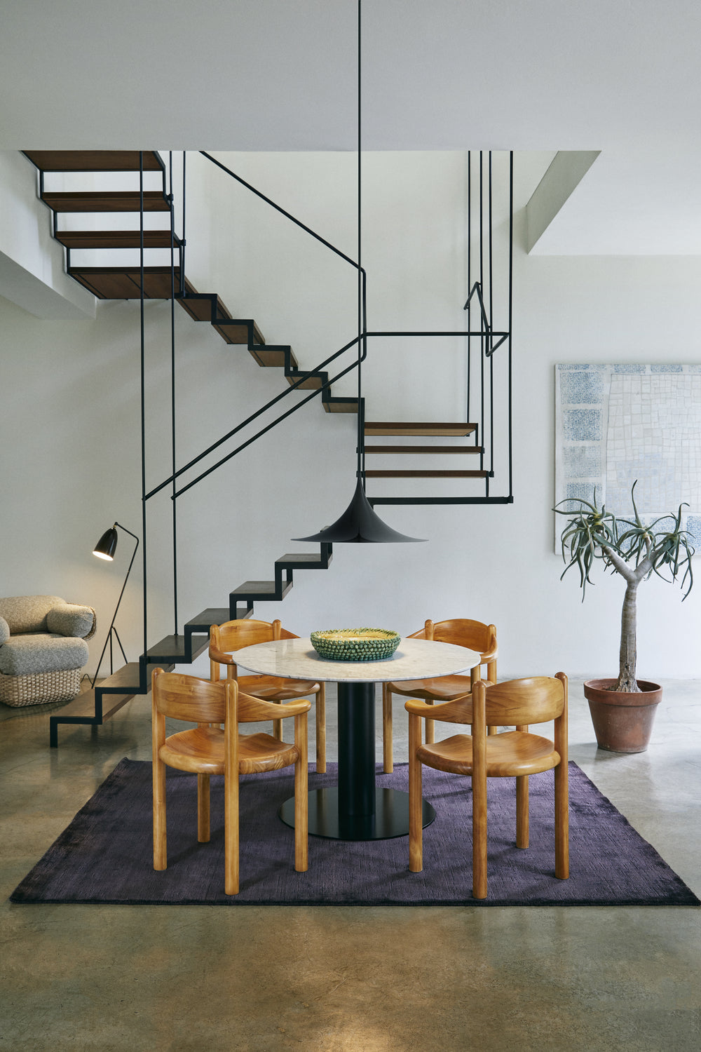 GrÃ¤shoppa Floor Lamp by GUBI shown in an interior setting