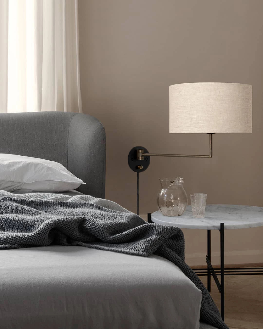 Gravity Wall Lamp by GUBI shown in an interior setting, view 2