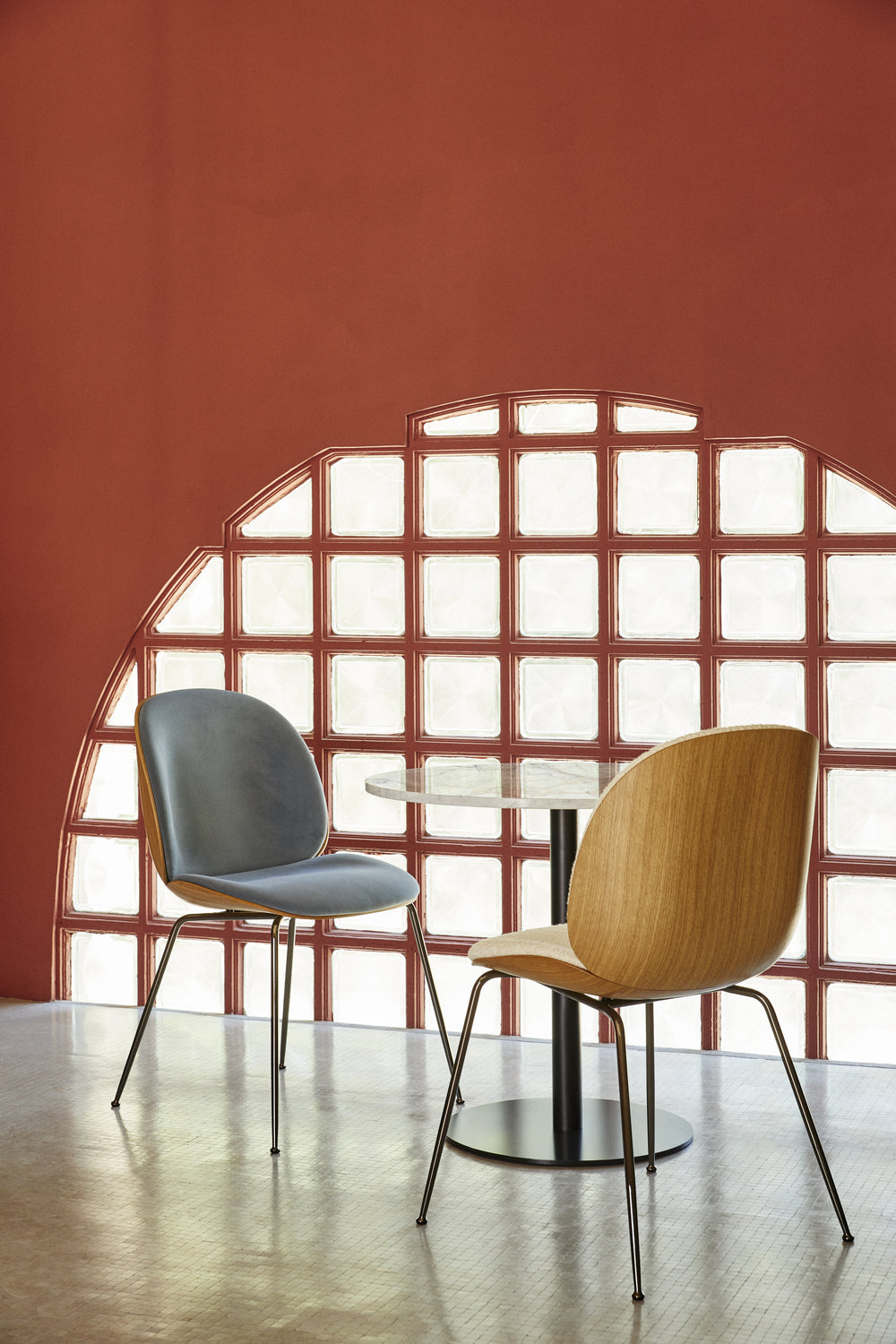 GUBI 1.0 Dining Table - Round by GUBI shown in an interior setting