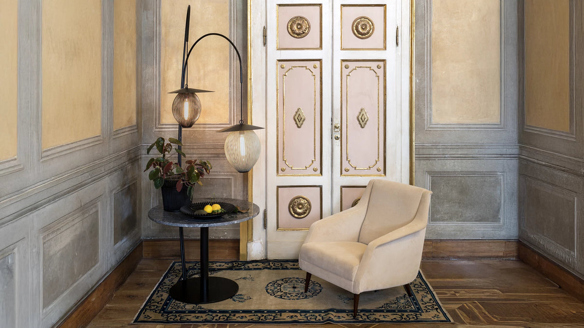 GUBI 1.0 Lounge Table - Round by GUBI shown in an interior setting