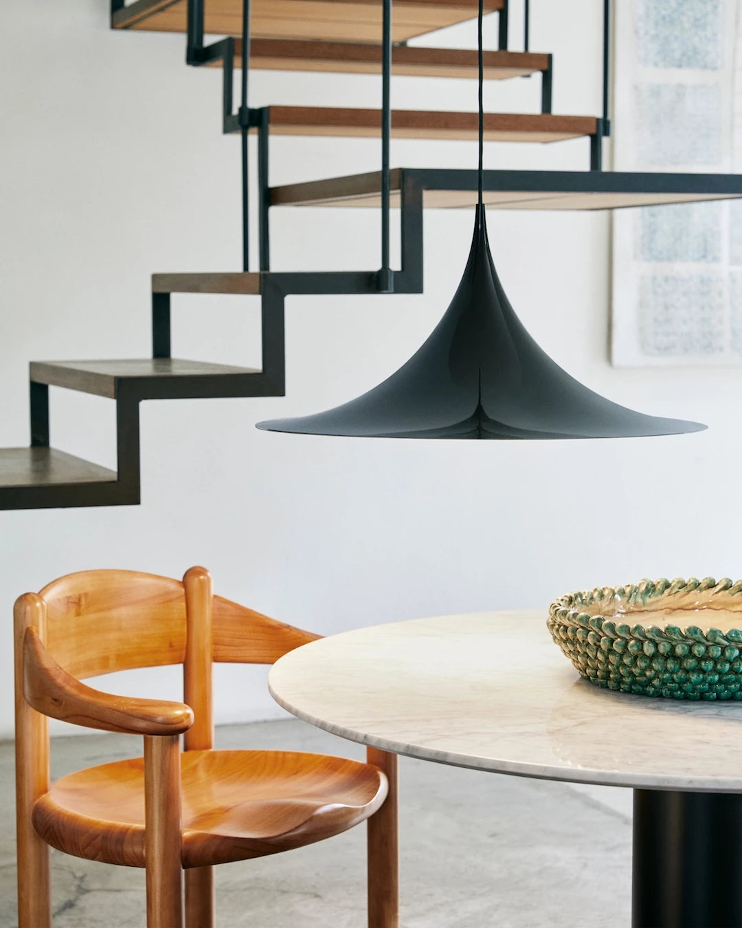 GUBI 2.0 Dining Table - Round by GUBI shown in an interior setting