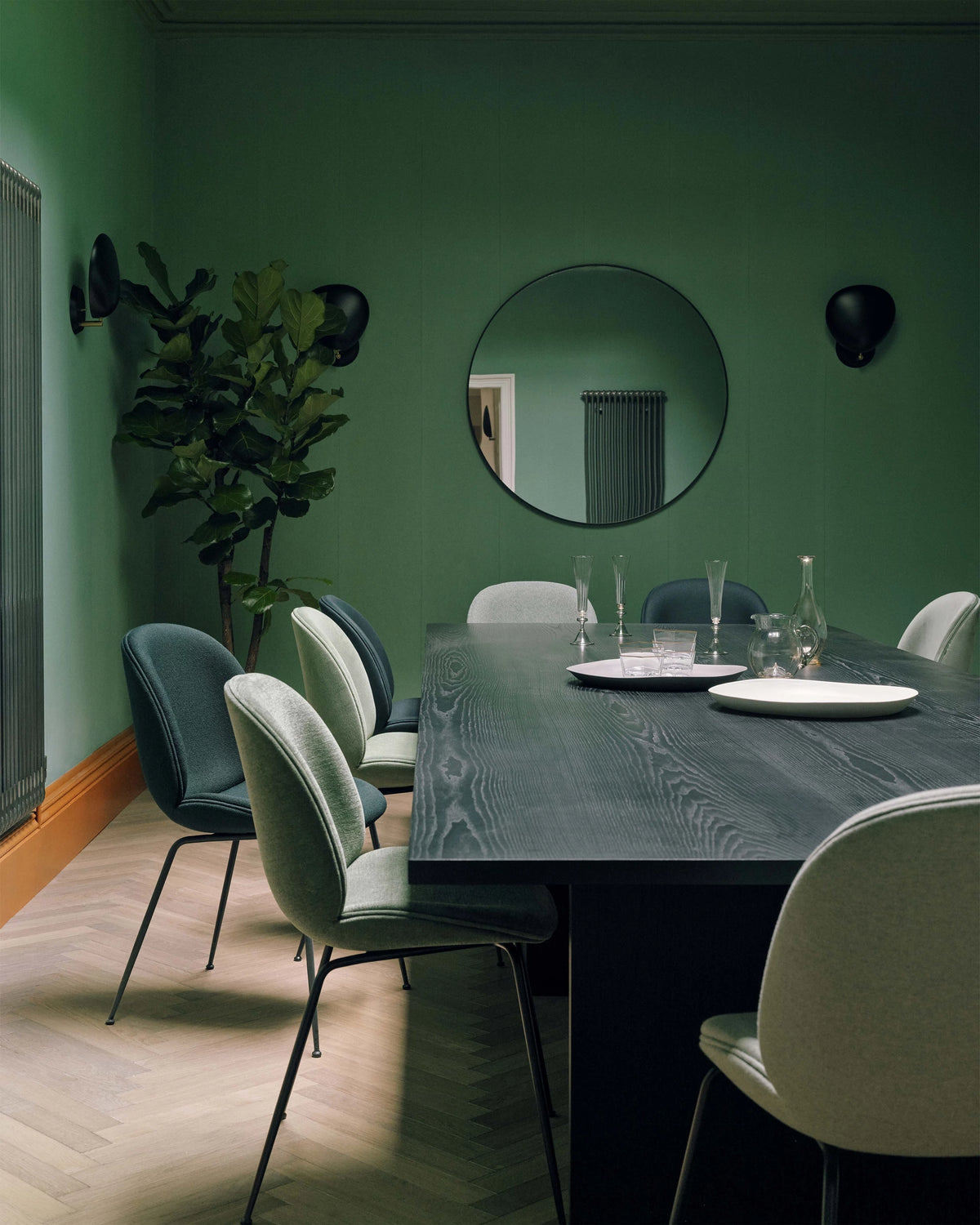 GUBI Wall Mirror by GUBI shown in an interior setting