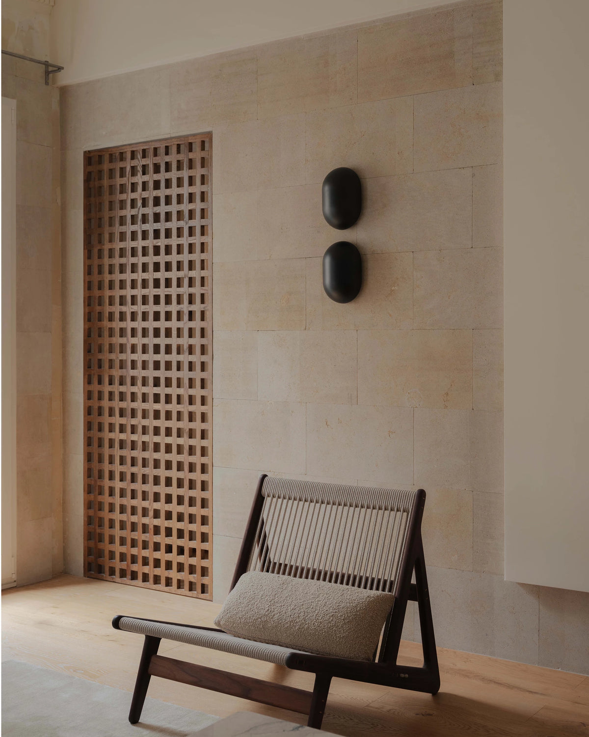 Howard Wall Lamp by GUBI shown in an interior setting, view 3