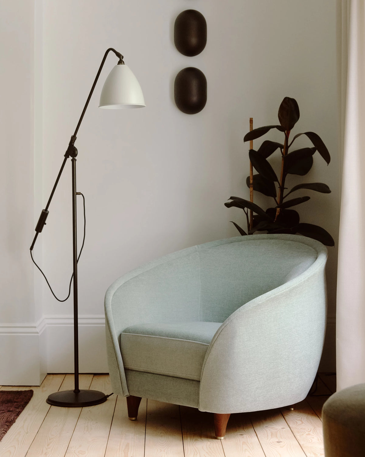 Howard Wall Lamp by GUBI shown in an interior setting, view 4