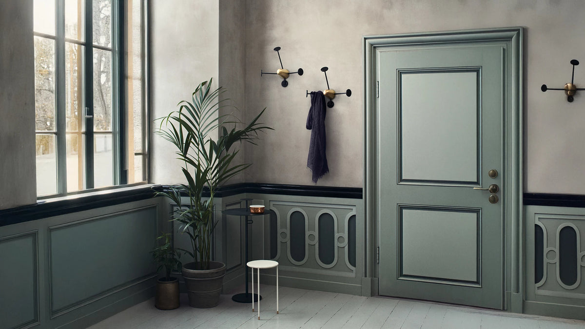 Matégot Coat Rack by GUBI shown in an interior setting