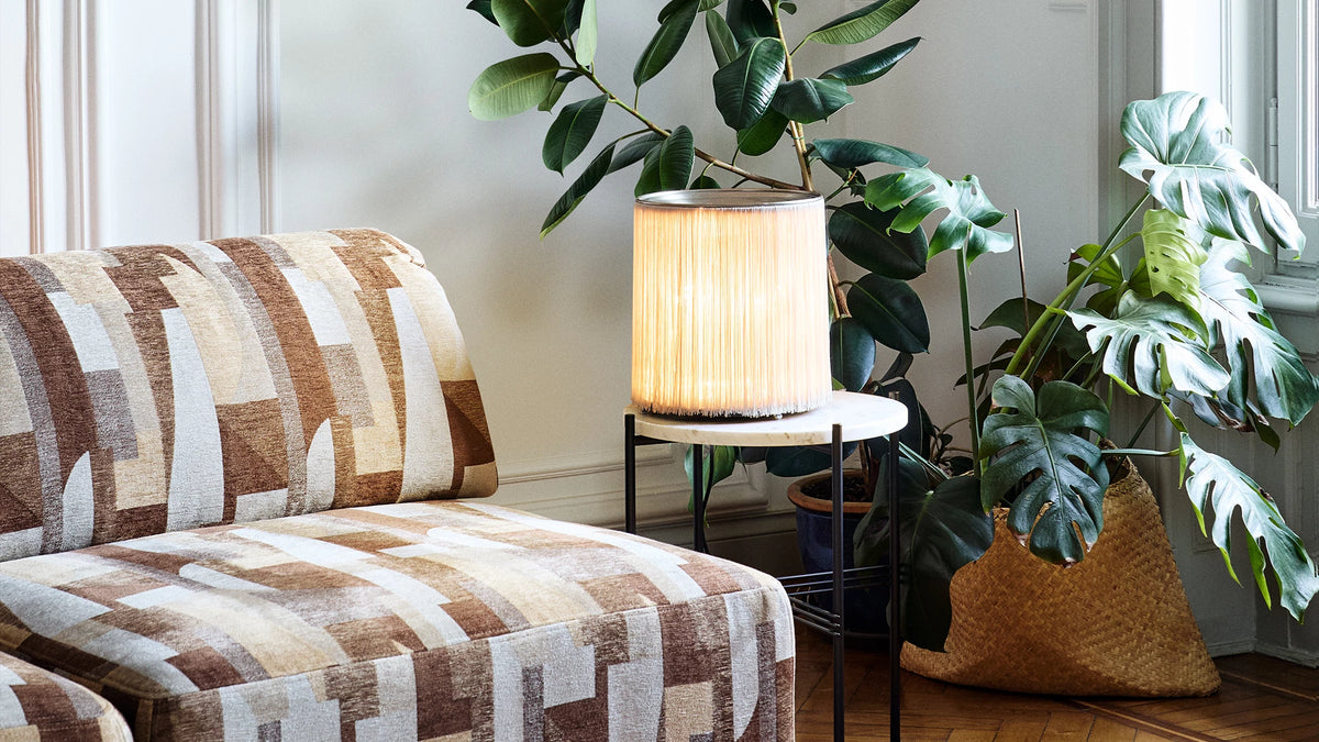 Model 597 Table Lamp by GUBI shown in an interior setting, view 1
