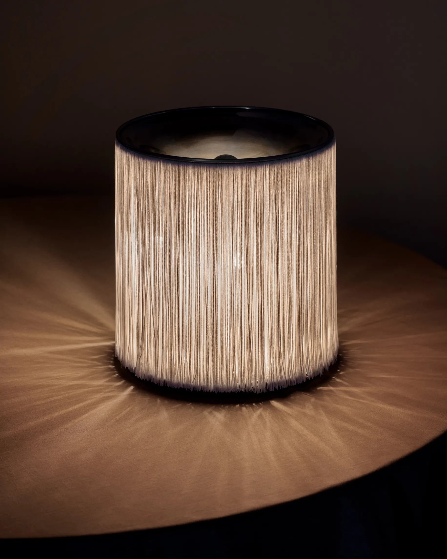Model 597 Table Lamp by GUBI shown in an interior setting, view 3