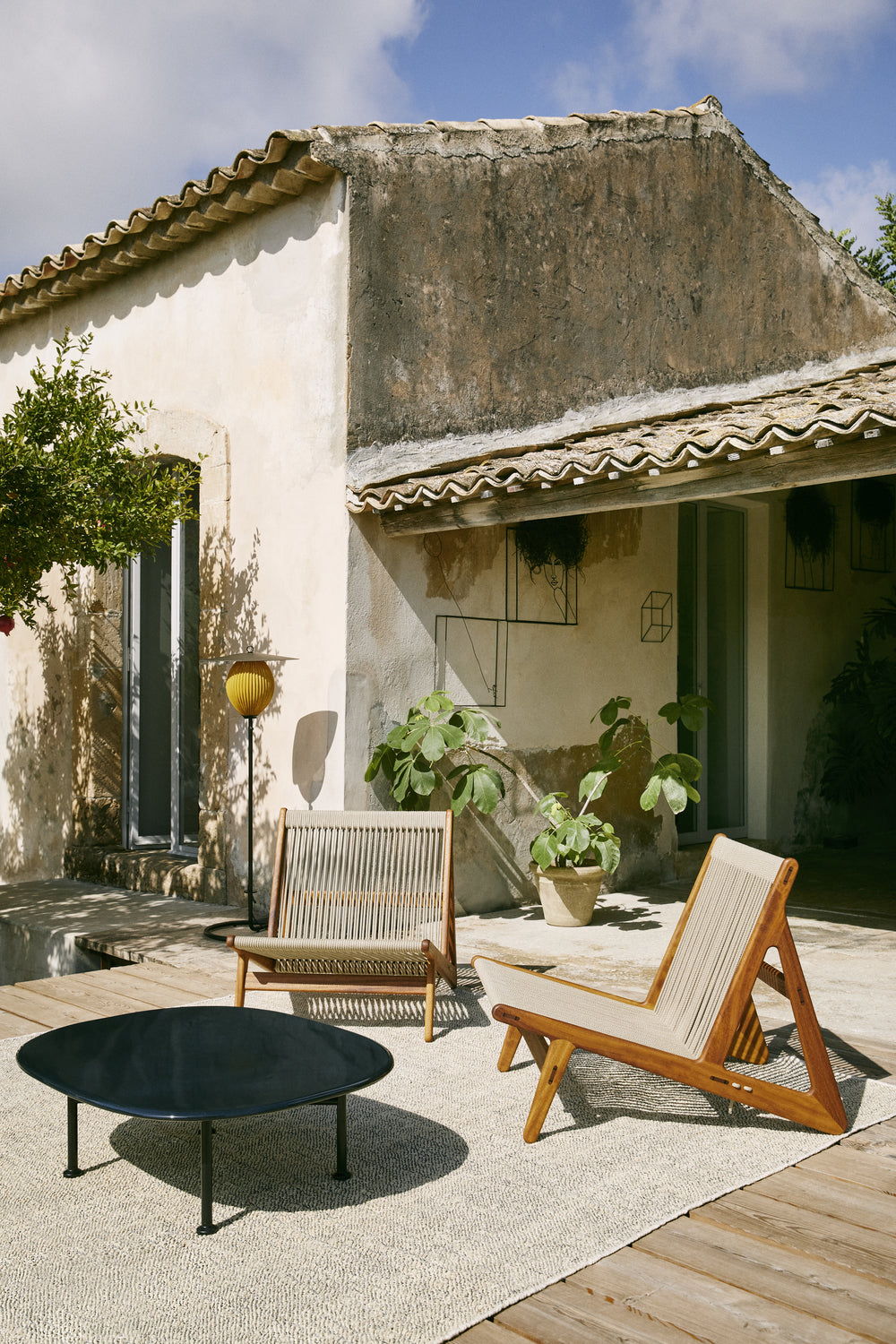 MR01 Initial Outdoor Lounge Chair by GUBI shown in an interior setting
