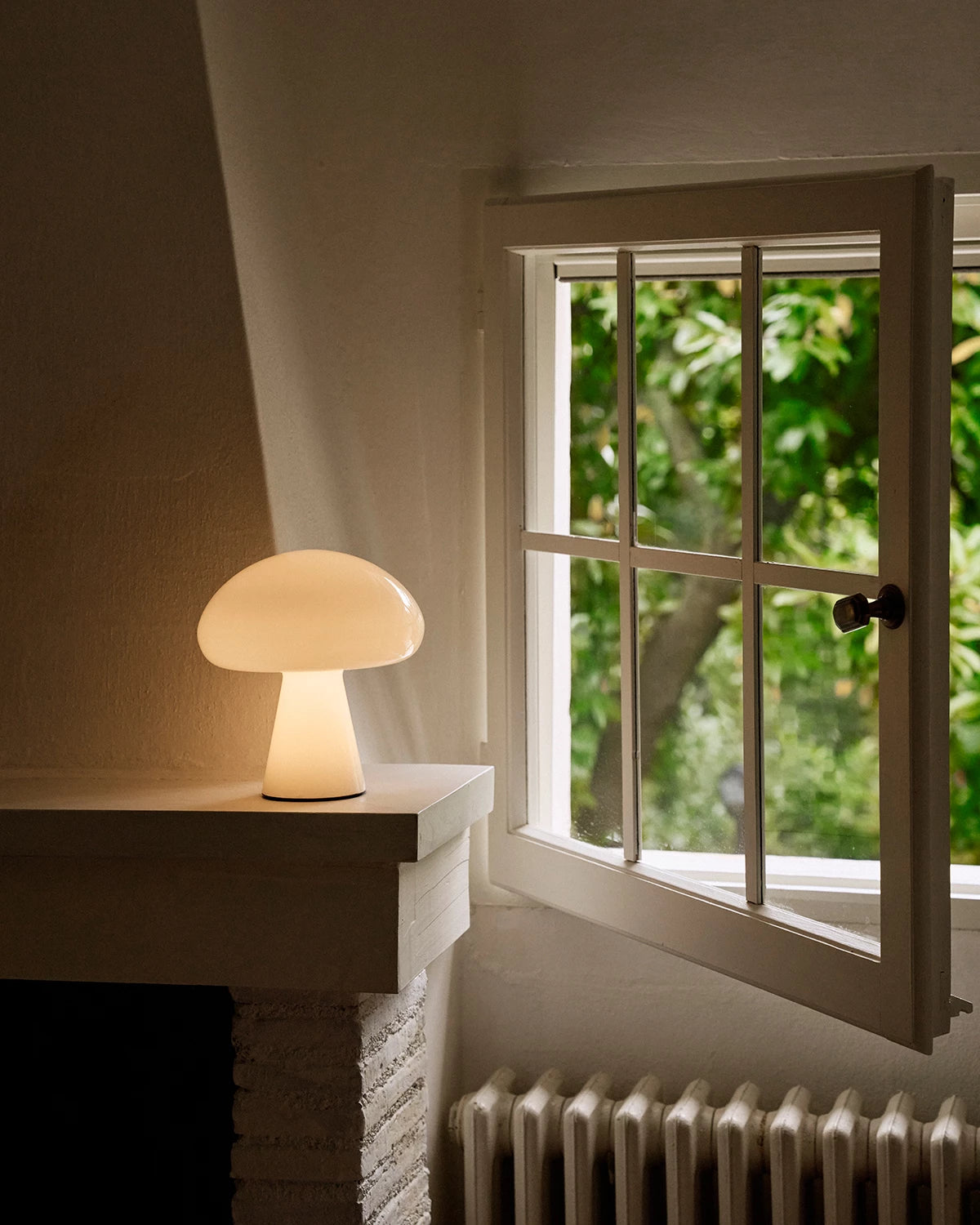 Obello Portable Lamp by GUBI shown in an interior setting, view 5