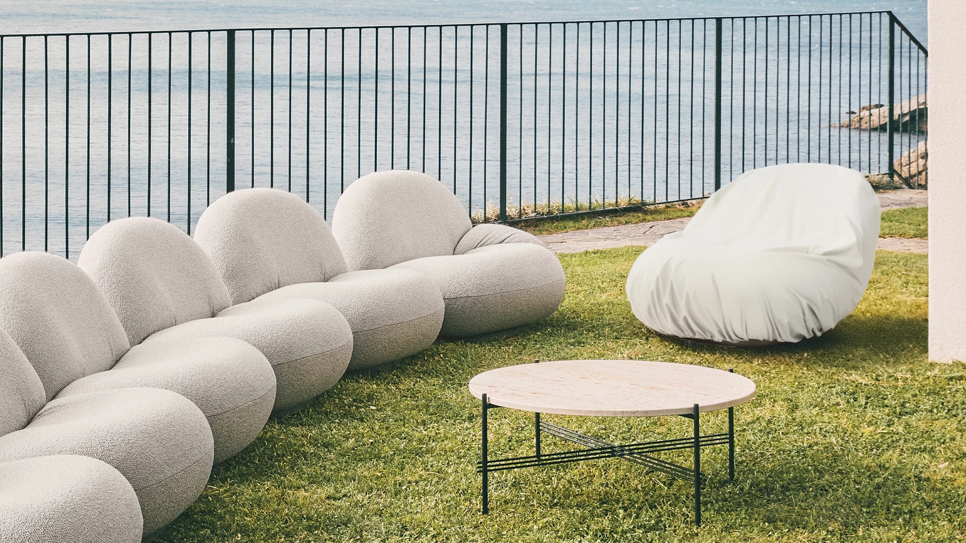 Pacha Outdoor Lounge Chair Cover by GUBI shown in an interior setting