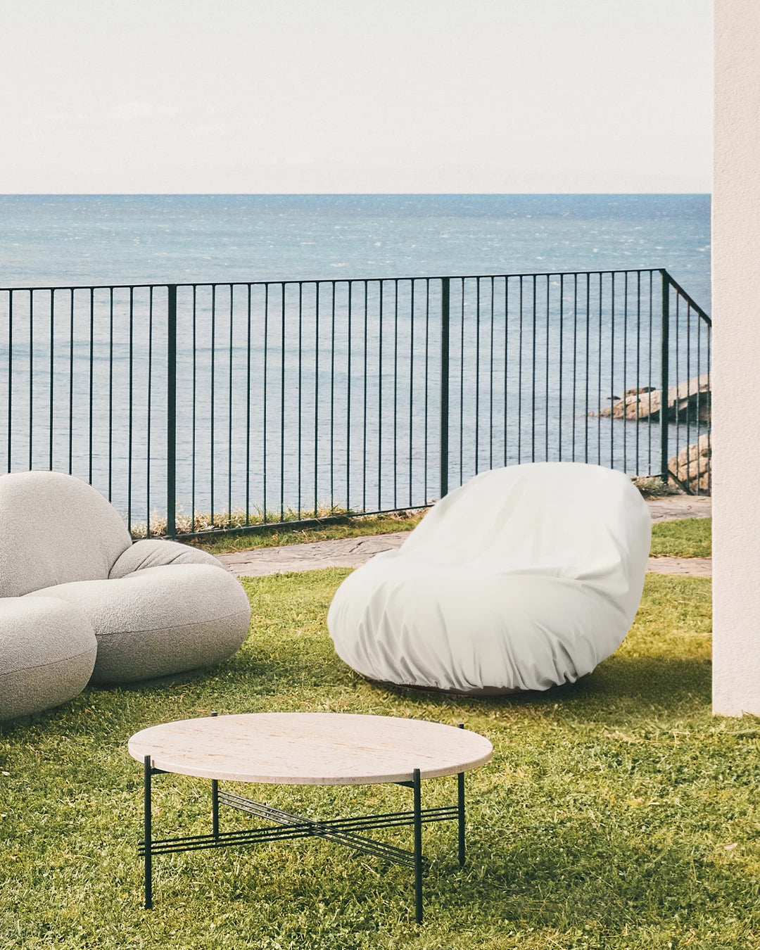 Pacha Outdoor Lounge Chair Cover by GUBI shown in an interior setting, view 2