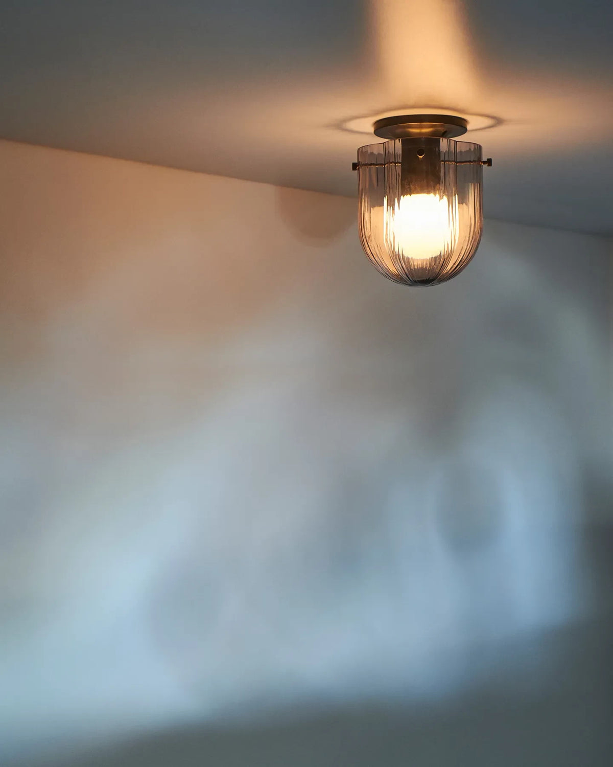 Seine Ceiling Lamp by GUBI shown in an interior setting, view 1