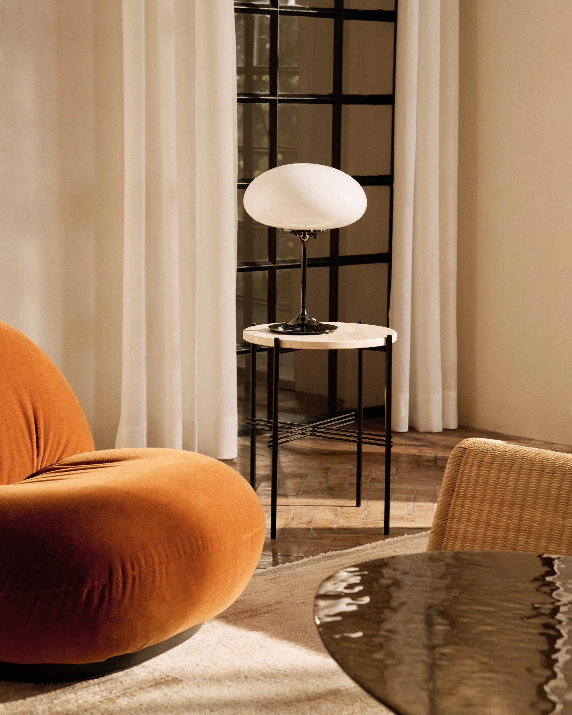Stemlite Wall Lamp by GUBI shown in an interior setting