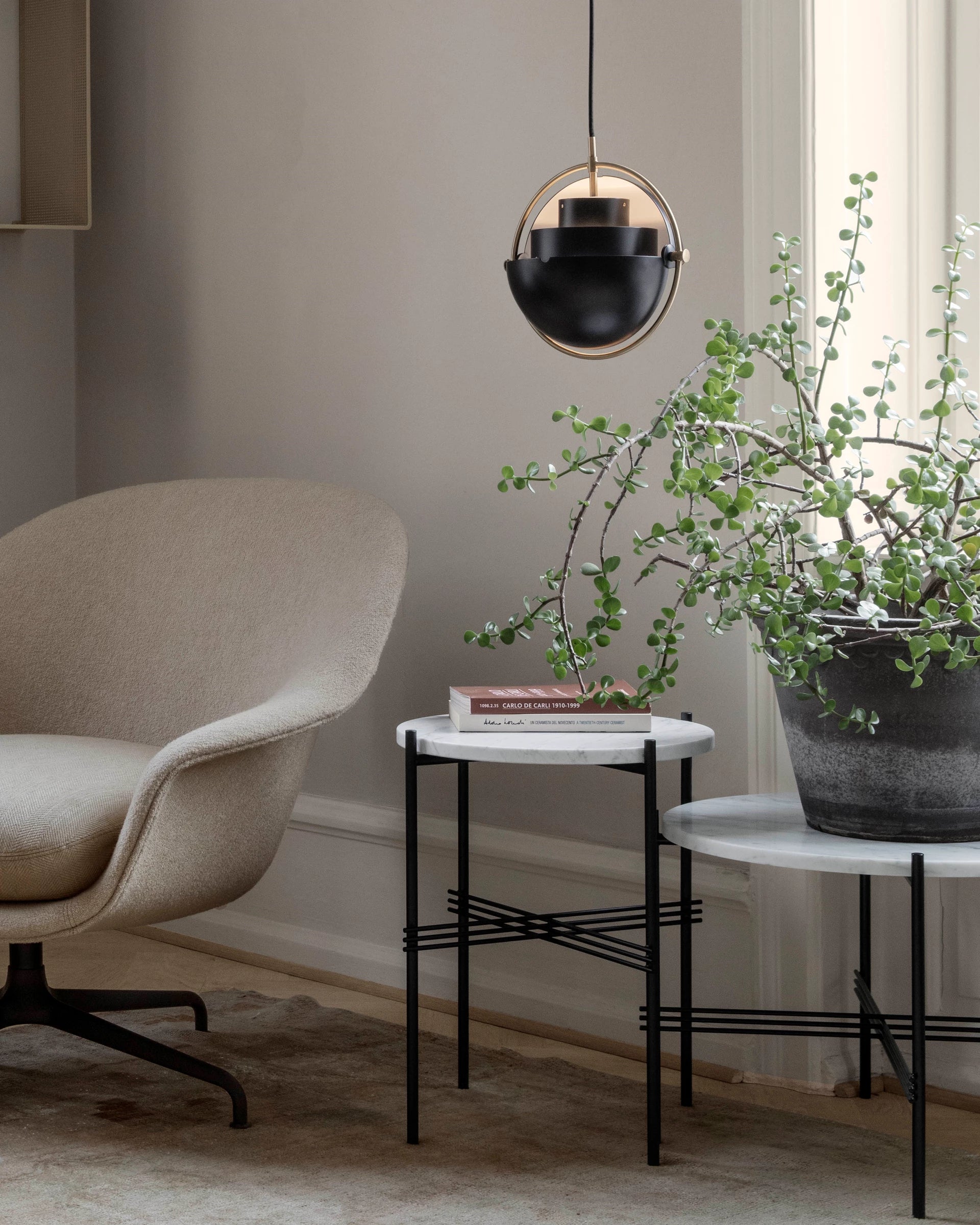 TS Side Table - Round by GUBI shown in an interior setting