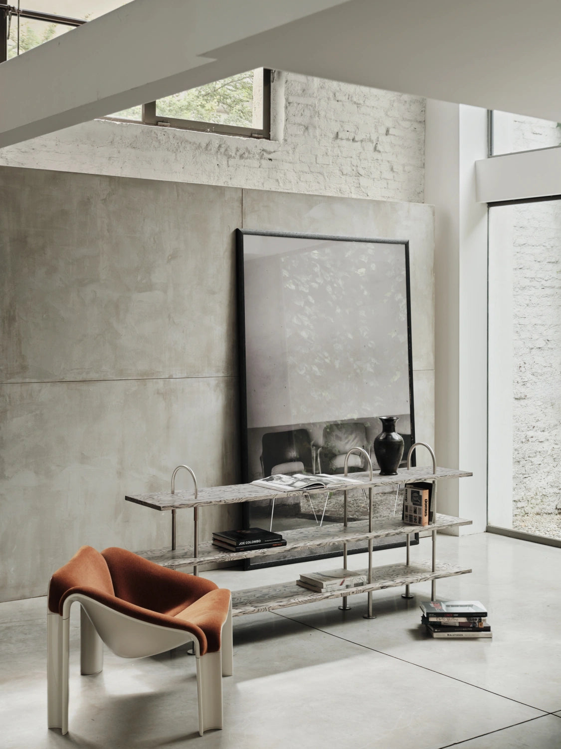 Low GUBI Keen Shelving System in ALPI veneer and satin stainless steel in a gallery-like interior